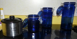Three insanely blue jars and one teeny tiny crock pot.