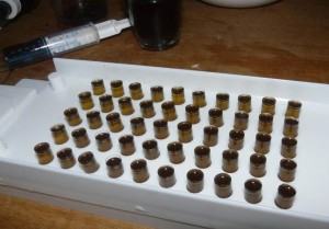 Filling cannabis oil capsules AKA canna caps source: BeyondChronic.com